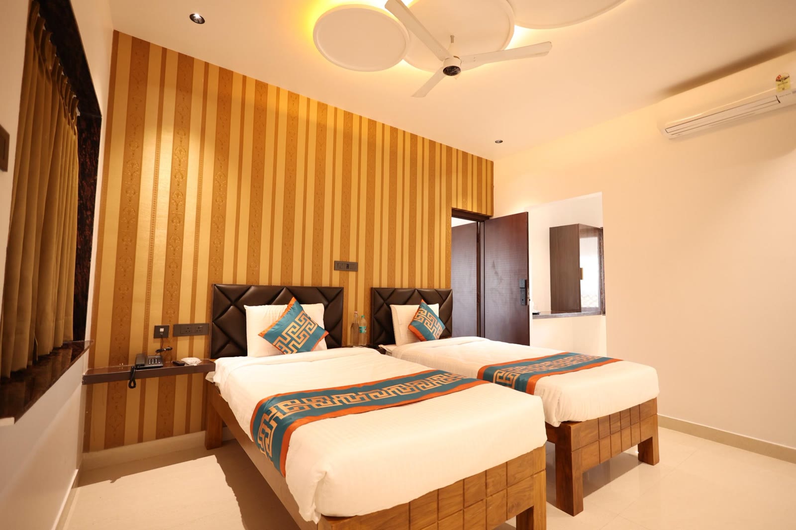 Connecting Room with twin beds at Samudra Beach Resorts, ideal for families and groups